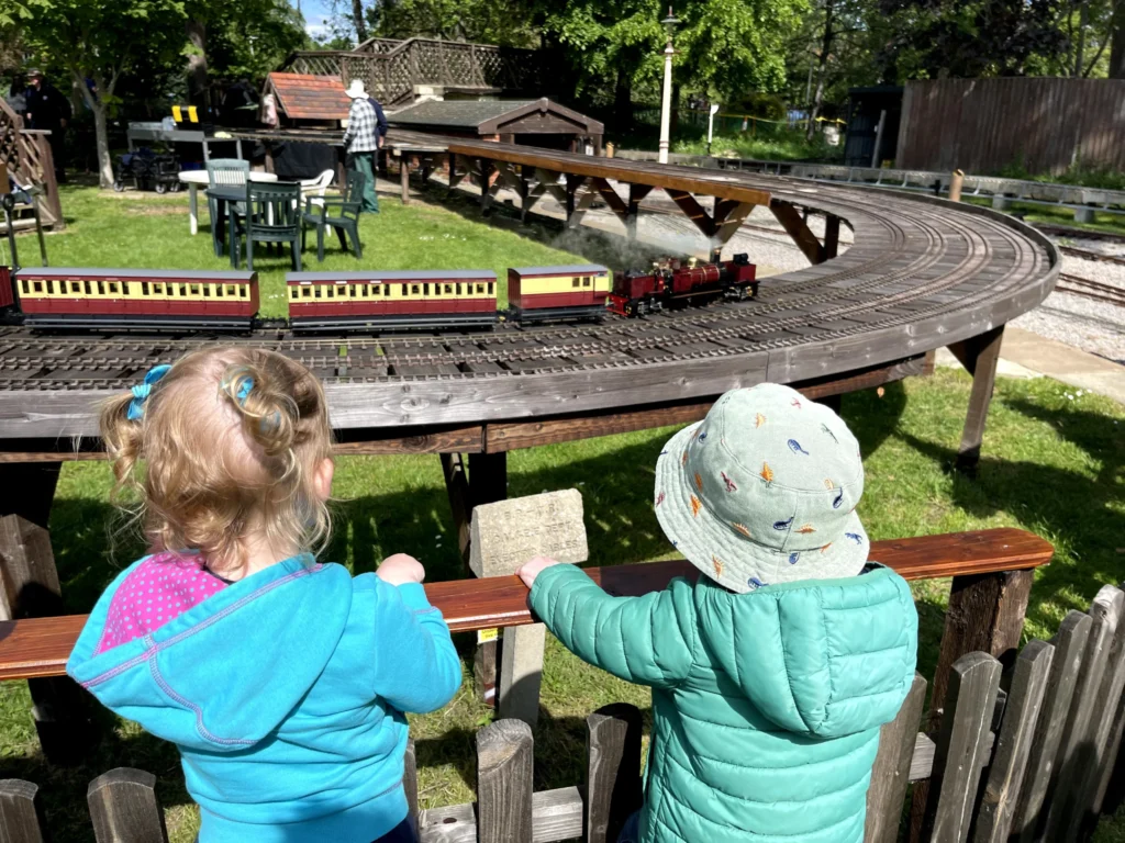 Children watching the miniature railway at the Cheltenham Society of Model Engineers