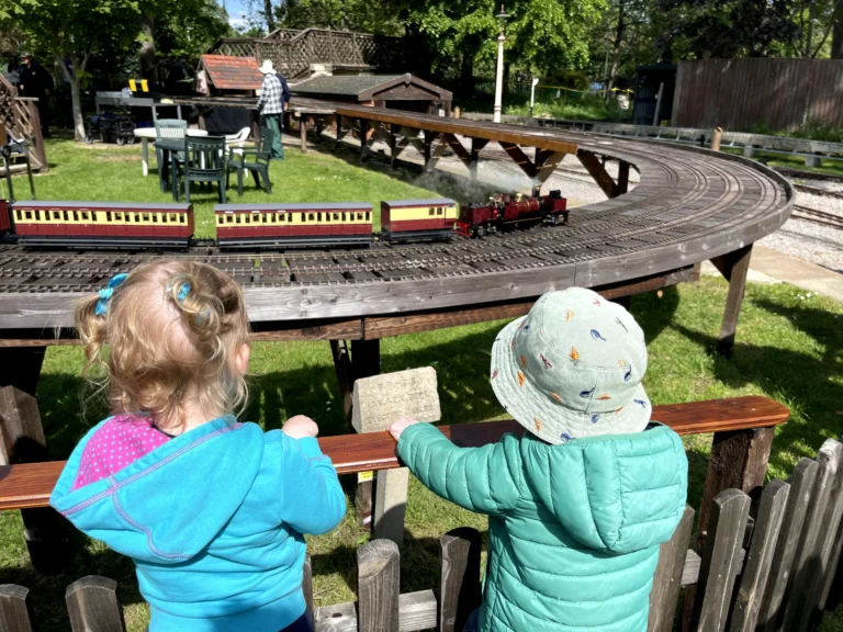 Children watching the miniature railway at the Cheltenham Society of Model Engineers