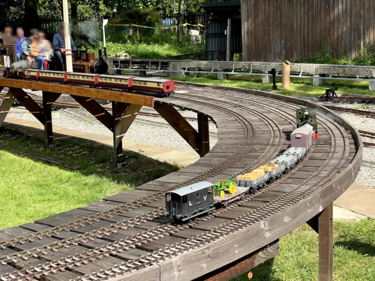 Miniature railway track and passengers at the Cheltenham Society of Model Engineers
