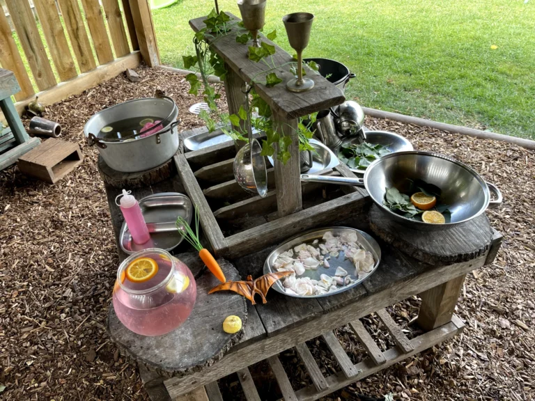Mud kitchen with pots and pans at Little Hedgehogs Play Garden