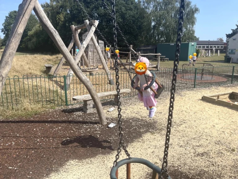 A child on a swing at The Orchard Coffee House