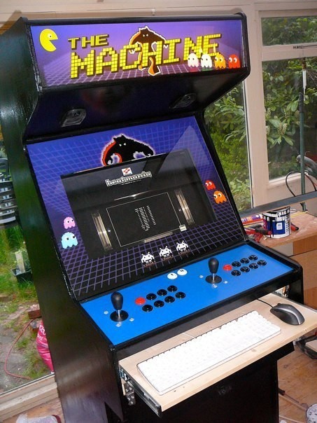 The keyboard tray pulled out under the control panel