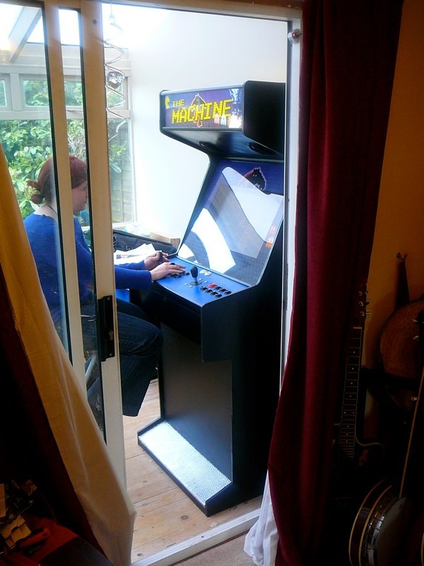 The Machine in use through the doorway