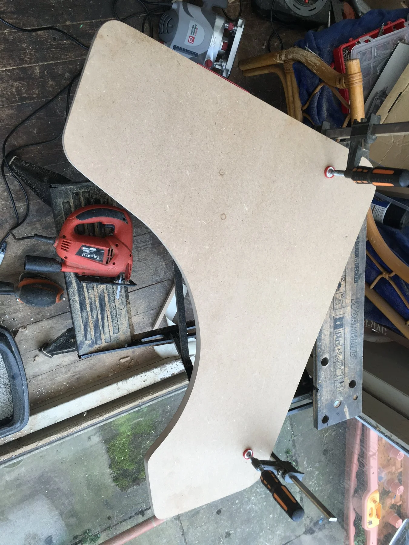 The first side clamped to the workbench next to the jigsaw