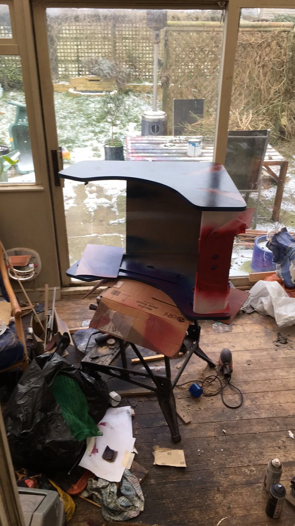 Spraying panels in the conservatory with snow outside